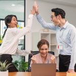 atinatin-asian-business-team-smile-raise-hands-up-celebration-feeling-happy-complete-finish-job-teamwork_74952-2803