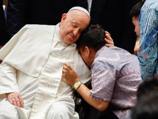 Pope Francis offers comfort to an individual during a meeting with a group of the sick, people with disabilities, and the poor, supported by various charitable organizations, at the Indonesian bishops’ conference headquarters in Jakarta, Indonesia, on Sept. 5, 2024. (CNS photo/Lola Gomez)