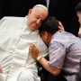 Pope Francis offers comfort to an individual during a meeting with a group of the sick, people with disabilities, and the poor, supported by various charitable organizations, at the Indonesian bishops’ conference headquarters in Jakarta, Indonesia, on Sept. 5, 2024. (CNS photo/Lola Gomez)